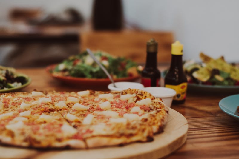 Spicy arrabbiata pizza with chili flakes and cherry tomatoes