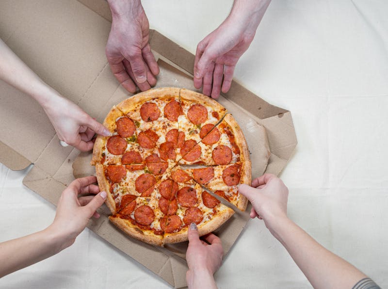 Community gathering for a special pizza day at Jet's Pizza