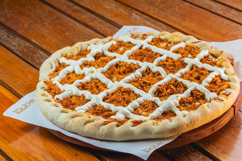 BBQ chicken pizza with caramelized onions and smoked gouda